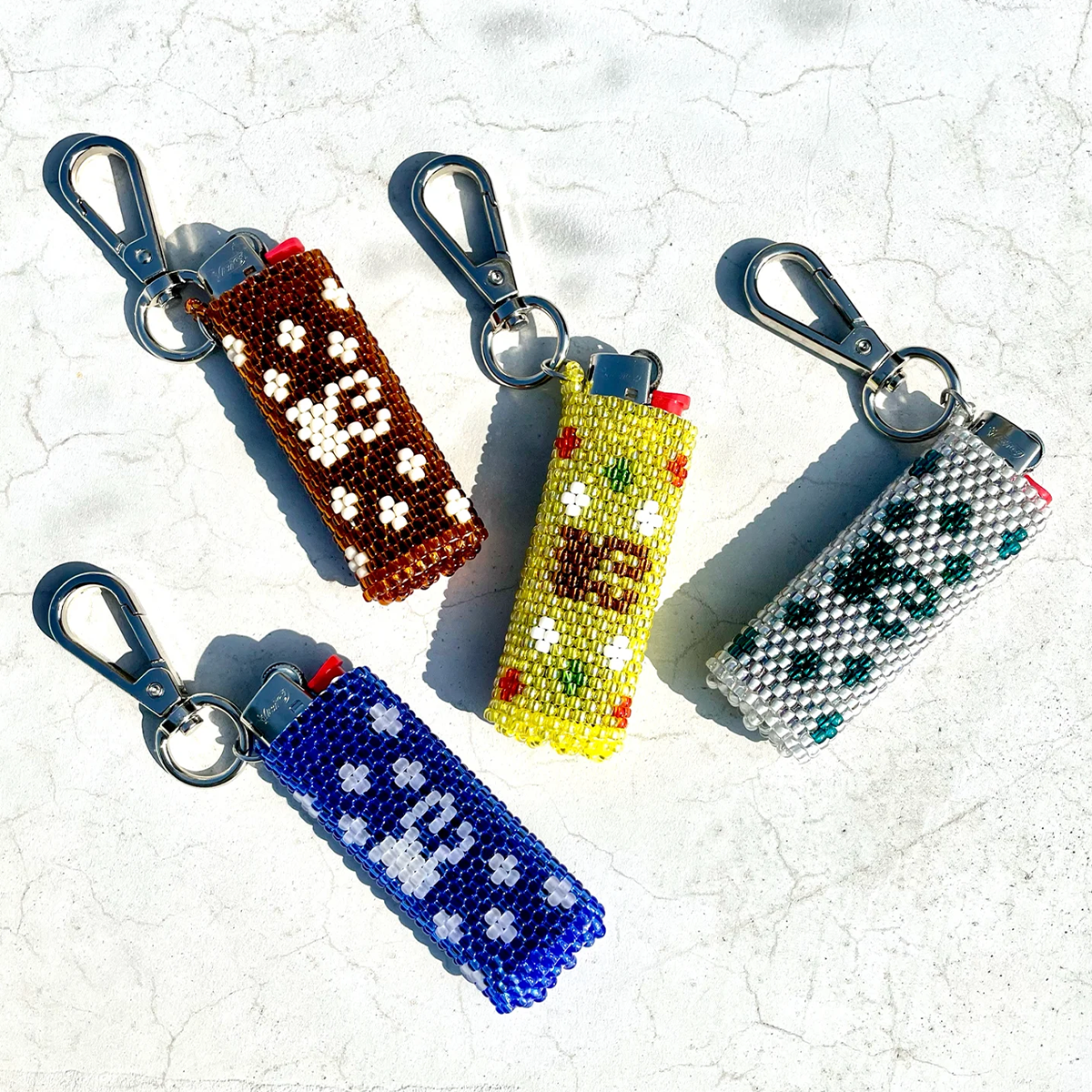 <img class='new_mark_img1' src='https://img.shop-pro.jp/img/new/icons8.gif' style='border:none;display:inline;margin:0px;padding:0px;width:auto;' />KirimeK Logo Beads Lighter Case (4Color)
                          </a>
            <span class=
