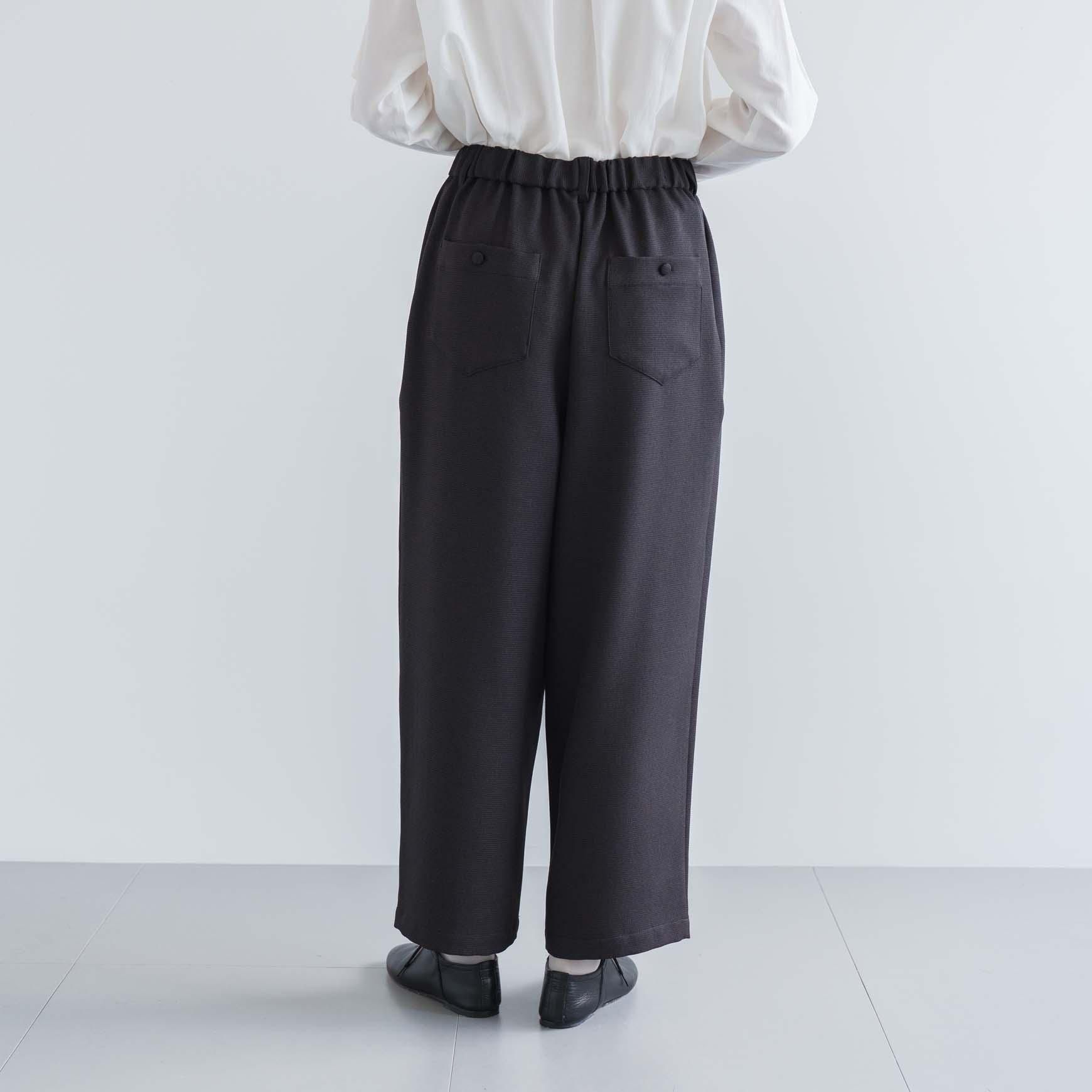 D の ポリエステルツイードのタックパンツ