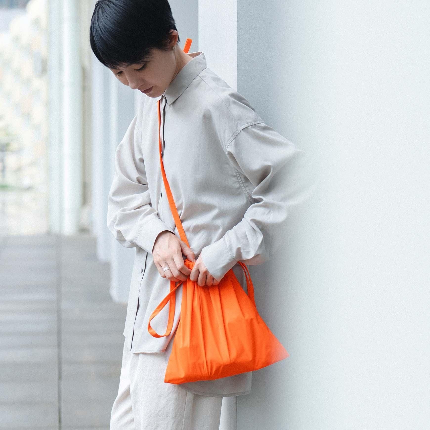 formuniform の Drawstring bag with strap 30 / オレンジ