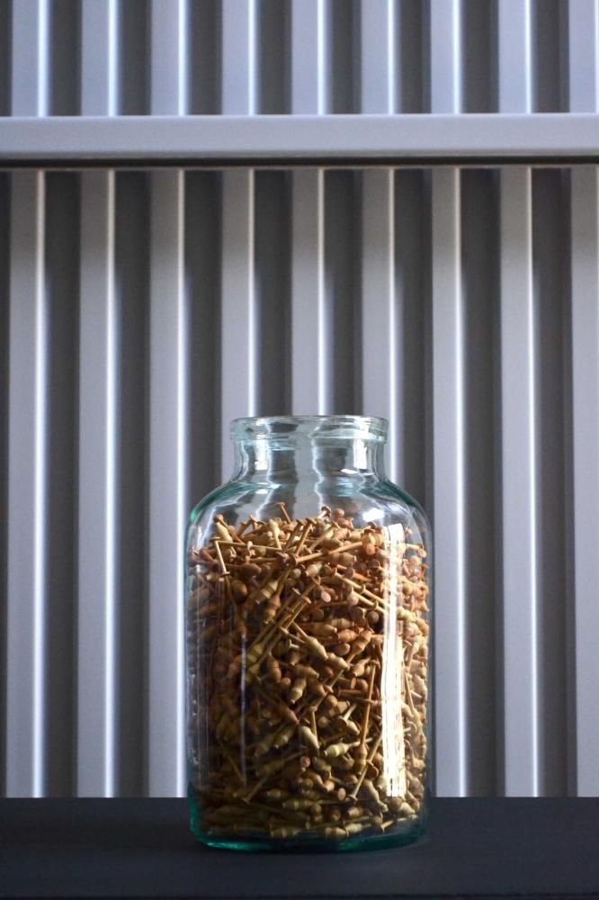 Bottle filled lace bobbin