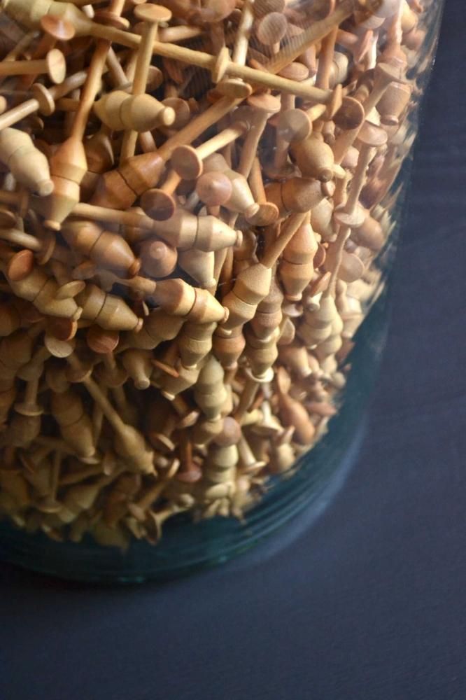 Bottle filled lace bobbin