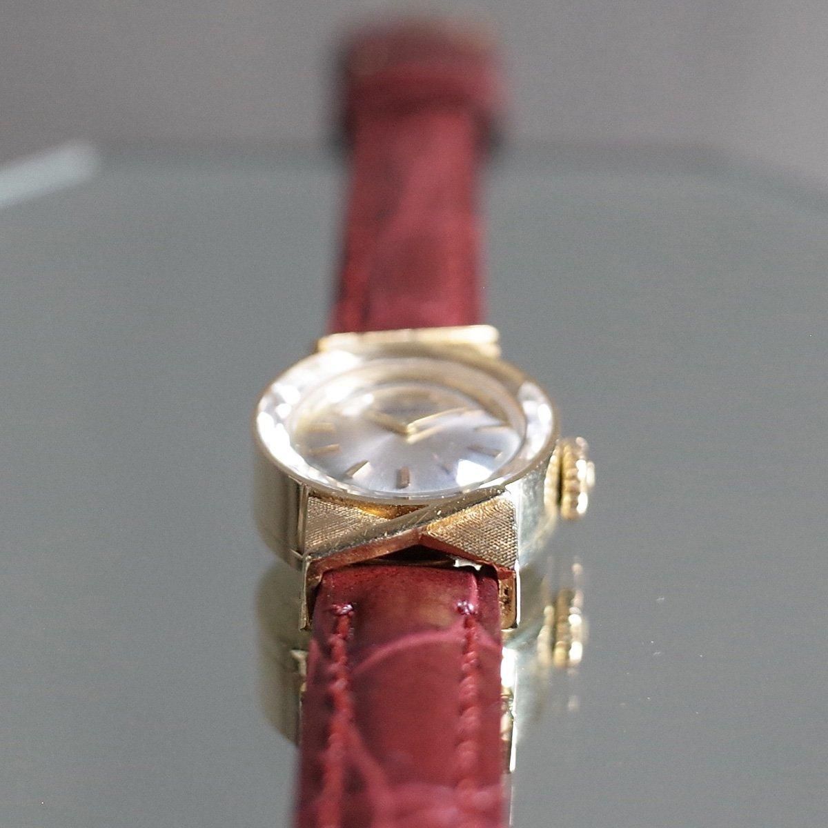 MOVADO（モバード）18KYG 金無垢 カットガラス リボンラグ