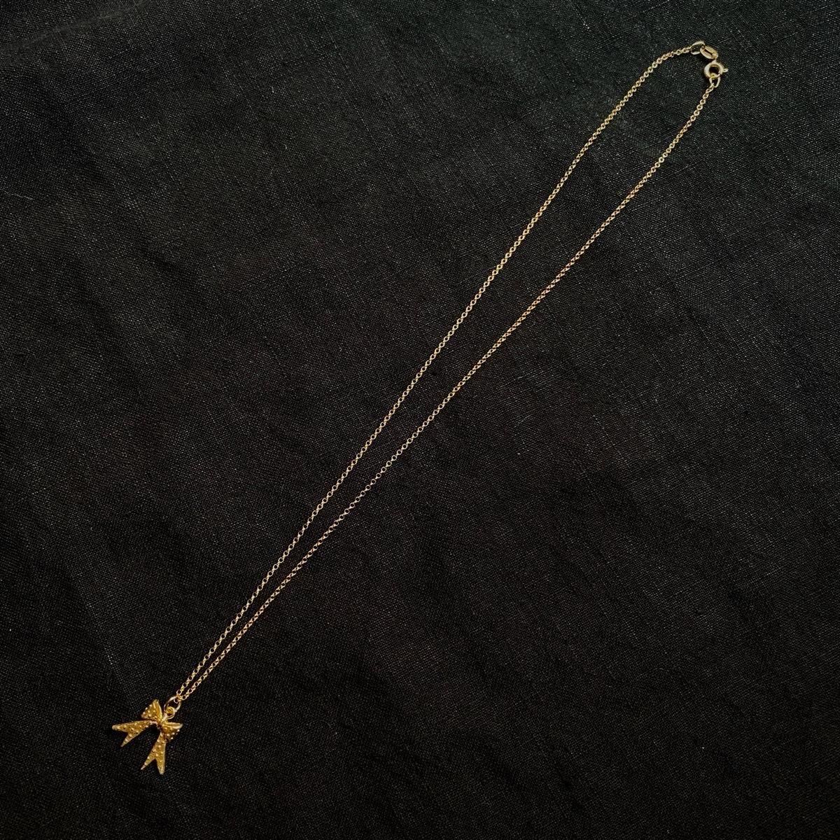 <img class='new_mark_img1' src='https://img.shop-pro.jp/img/new/icons13.gif' style='border:none;display:inline;margin:0px;padding:0px;width:auto;' />momocreatura Dotted bow Necklace Goldʥ⥯ꥢ ɥåȥܥ ͥå쥹 ɡ