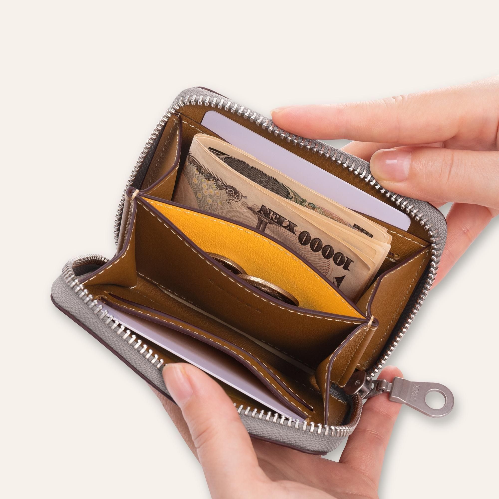 洗練された機能美。ラウンドファスナー ミニ財布｜手のひらサイズに