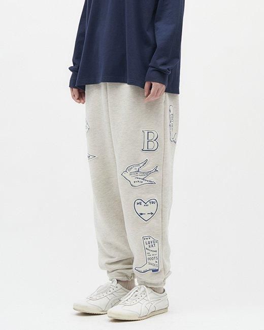 サインボードワッペンパッチワークスウェットパンツ