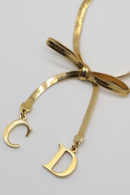 USED】 Christian Dior / CD logo charm ribbon motif bracelet USED】 Christian Dior / CD logo charm ribbon motif bracelet