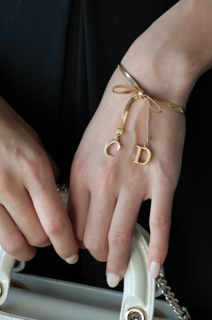 USED】 Christian Dior / CD logo charm ribbon motif bracelet