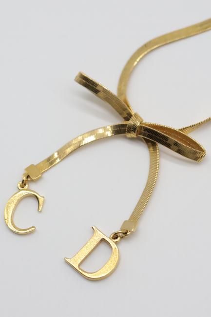 USED】 Christian Dior / CD logo charm ribbon motif bracelet