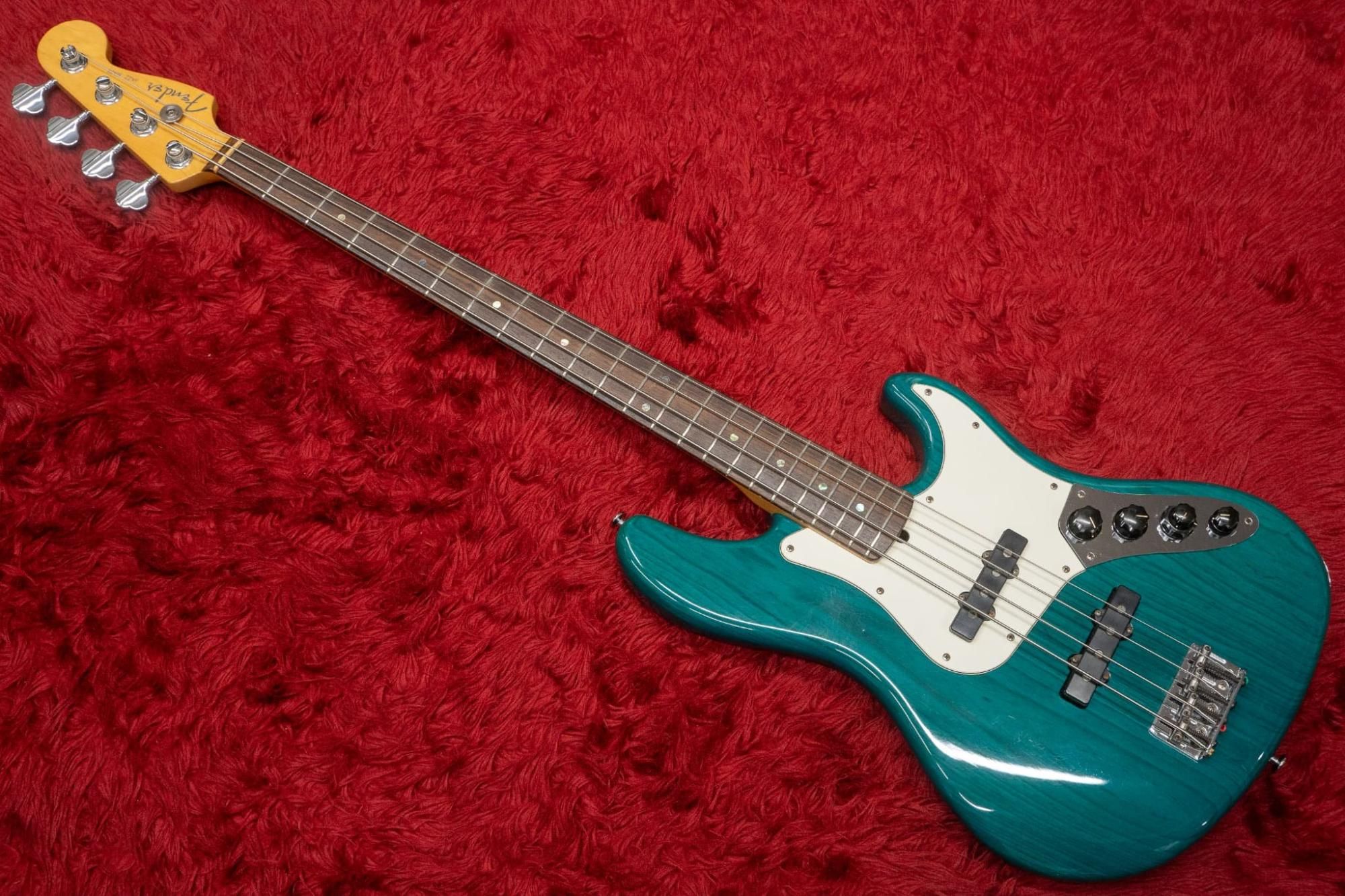 used】Fender / American Deluxe Jazz Bass 4st Teal Green Trans 1999