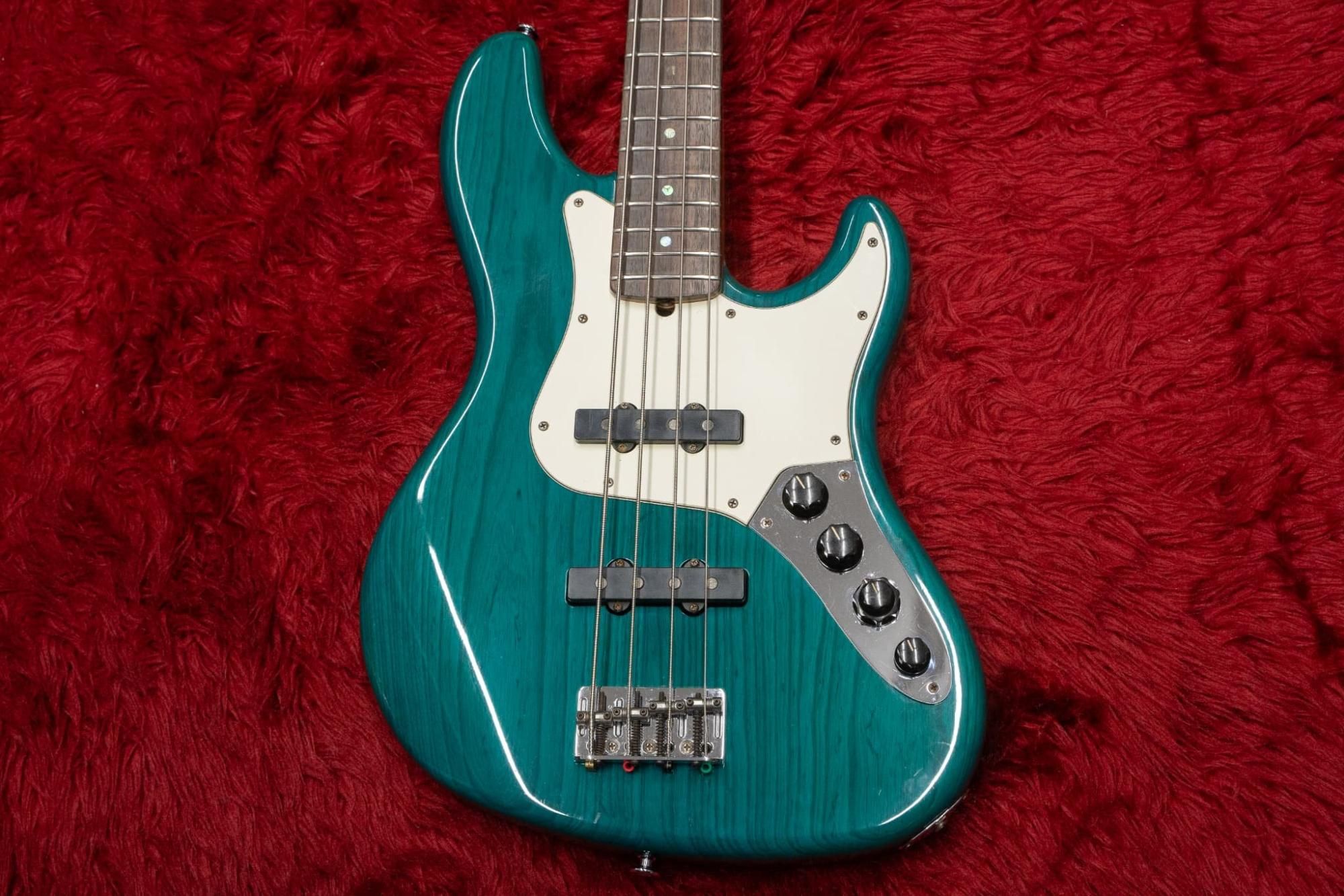 used】Fender / American Deluxe Jazz Bass 4st Teal Green Trans 1999