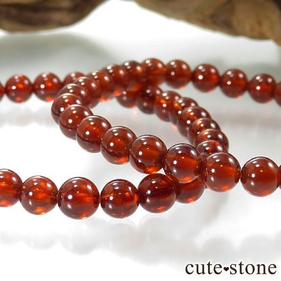【1/2売り対象】ヘソナイト(オレンジガーネット) AAA のシンプルブレスレット 5.5mmの写真1 cute stone