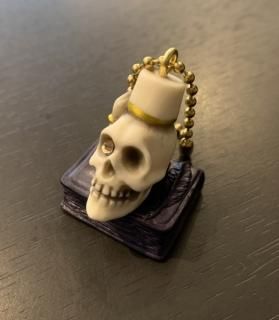 Book on fezzhat skull key chain