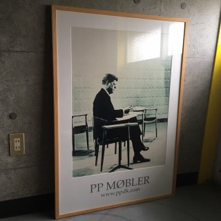 Poster for PP Møbler Kennedy sitting in The Chair/ Hans J. Wegner