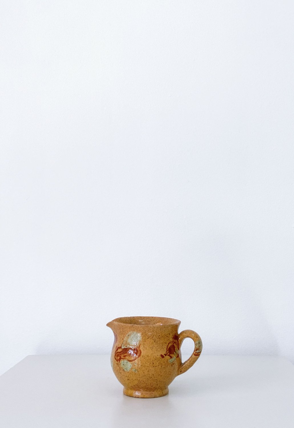 SMALL ANTIQUE PITCHER
