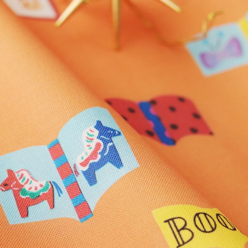 るぅページ BookBookBook（オレンジ）文房具柄- 布・生地の通販サイト