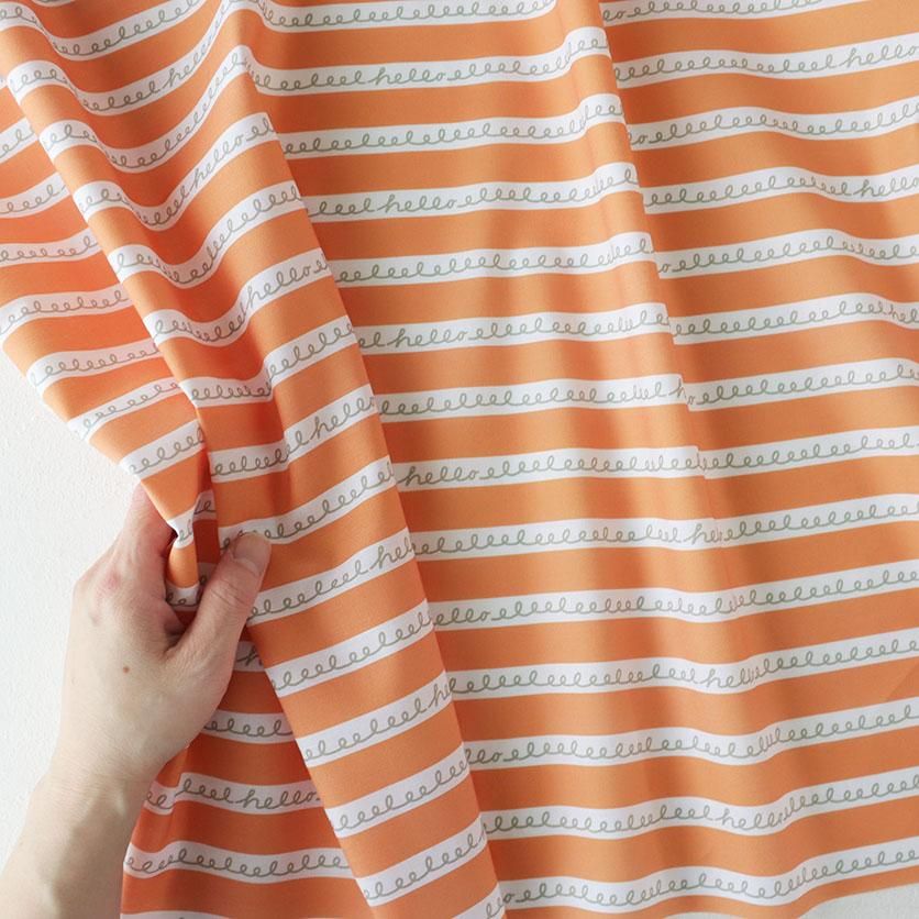 くるっくるっくるん しましま（オレンジ）幾何学模様- 布・生地