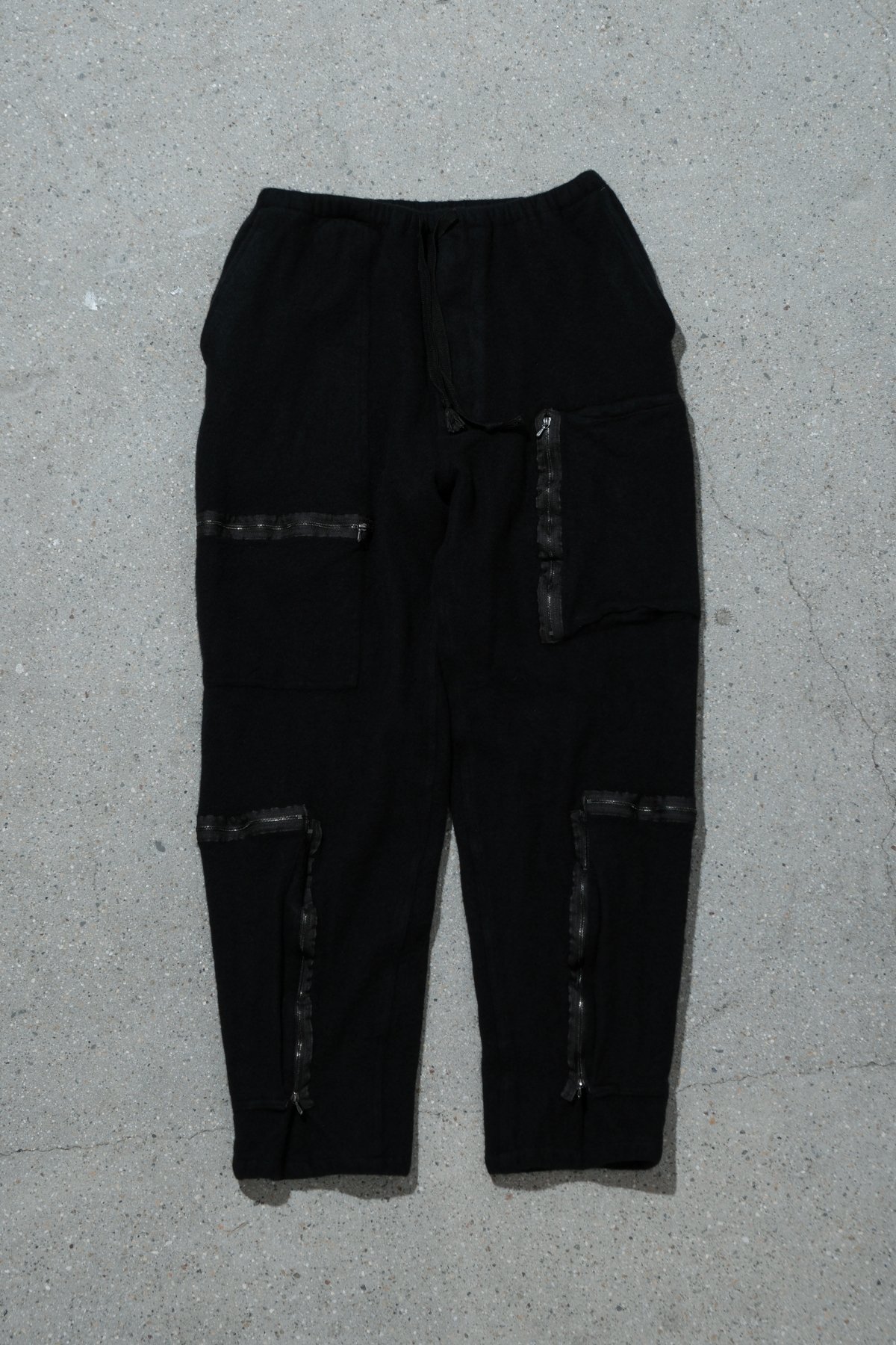 COMOLI / SHRINKED WOOL PARACHUTE PANTS