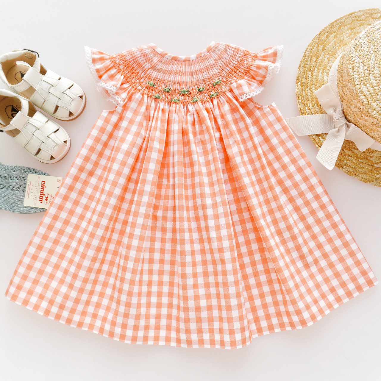 <img class='new_mark_img1' src='https://img.shop-pro.jp/img/new/icons1.gif' style='border:none;display:inline;margin:0px;padding:0px;width:auto;' />dBb ideas - Naranja vichy smocked dress