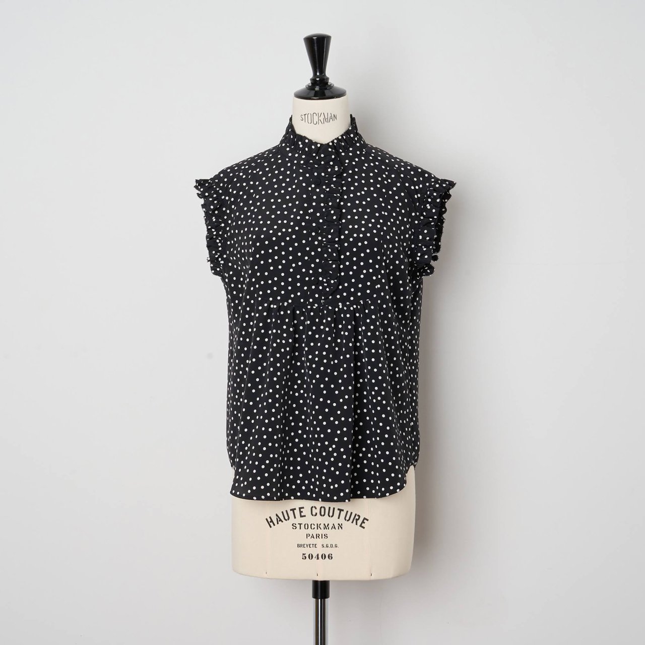 Pale Jute <BR> polka dot sleeveless blouse<BR> black  white