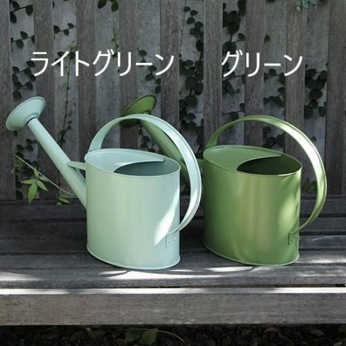Green outdoor watering can