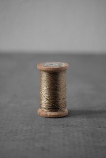 Spool with gold thread 