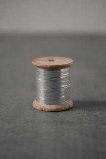 Spool with silver thread 