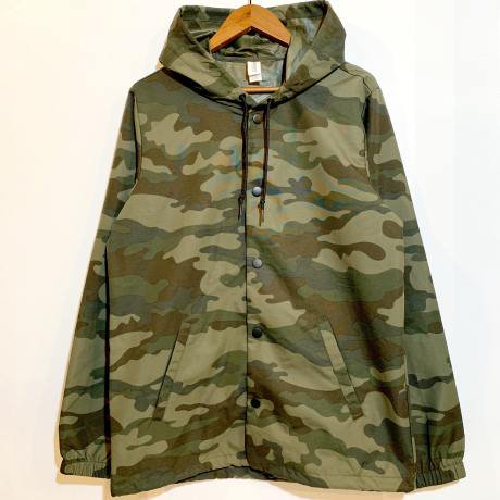 <div>INDEPENDENT</div>WATER RESISTANT<br>NYLON COACH HOODIE<br>CAMO