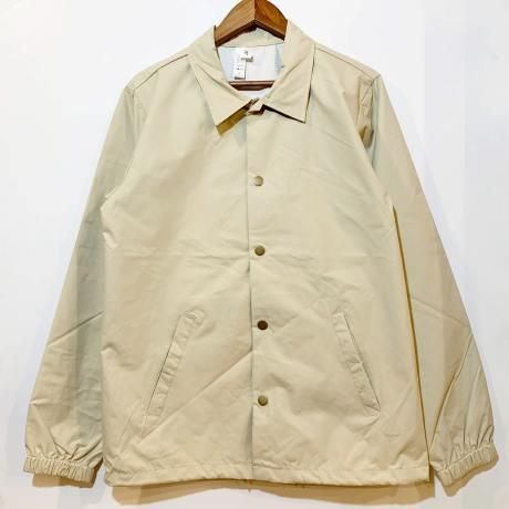 <div>INDEPENDENT</div>WATER RESISTANT<br>NYLON COACH JACKET<br>KHAKI