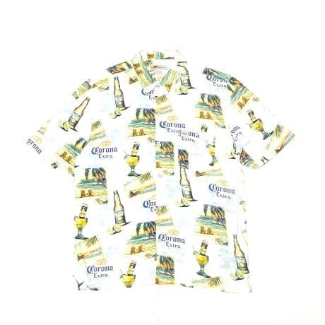 <div>CORONA EXTRA</div>OFFICIAL<br>PRINT SHIRT<br>WHITE