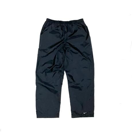 <div>NIKE</div>NYLON RAIN PANTS<br>00's DEADSTOCK<br>SWOOSH<br>BLACK w LINNER