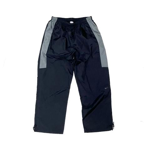 <div>NIKE</div>NYLON TRACK PANTS<br>00's DEADSTOCK<br>SWOOSH<br>BLK x GRY w LINNER