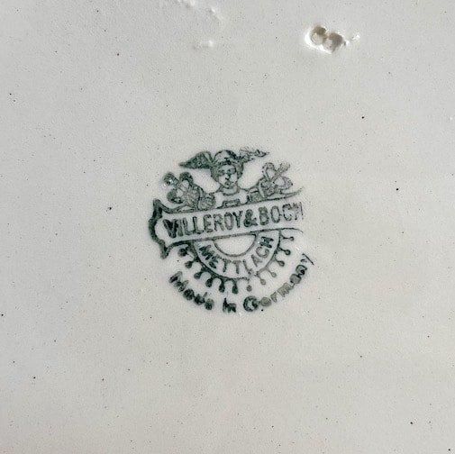 Antique BOCH flower rim plate.a
