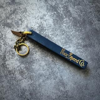 The old hotel key had a key ring that looked like thismetallic dark blue