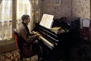 ピアノを弾く若い男