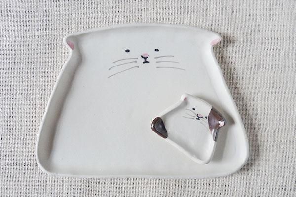 ڷ